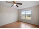 Bedroom with a ceiling fan and a window allowing natural light at 5321 Cog Hill Ct, Raleigh, NC 27604