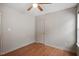 This bedroom features hardwood floors, ceiling fan, and neutral paint at 5321 Cog Hill Ct, Raleigh, NC 27604