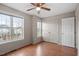 Bright bedroom with dual windows, wood floors and a closet provides comfort at 5321 Cog Hill Ct, Raleigh, NC 27604