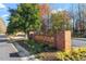 Welcoming entrance to Hedingham community with brick signage and landscaped flower beds at 5321 Cog Hill Ct, Raleigh, NC 27604