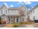 Charming two-story townhome with well-maintained landscaping and a welcoming front porch at 5321 Cog Hill Ct, Raleigh, NC 27604
