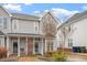 Charming two-story townhome with well-maintained landscaping and a welcoming front porch at 5321 Cog Hill Ct, Raleigh, NC 27604
