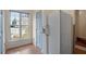 Kitchen area with stainless steel refrigerator and natural light at 5321 Cog Hill Ct, Raleigh, NC 27604