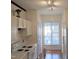 Cozy kitchen with white cabinets, subway tile backsplash, and ample natural light at 5321 Cog Hill Ct, Raleigh, NC 27604
