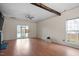 Spacious living room featuring hardwood floors, a fireplace, and a walk-out porch at 5321 Cog Hill Ct, Raleigh, NC 27604