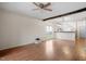 Spacious living room featuring hardwood floors and natural light from large windows at 5321 Cog Hill Ct, Raleigh, NC 27604