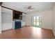 Bright living room with fireplace, built-in shelving, and sliding doors to the outdoor area at 5321 Cog Hill Ct, Raleigh, NC 27604