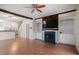 Cozy living room with fireplace, built-in shelving, and hardwood floors at 5321 Cog Hill Ct, Raleigh, NC 27604