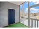Comfortable sunroom with walls, artificial turf, and natural light at 5321 Cog Hill Ct, Raleigh, NC 27604