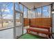 Cozy sunroom with natural light, bench seating, and fan at 5321 Cog Hill Ct, Raleigh, NC 27604