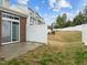 Backyard view of property with patio, fence, and greenery at 533 Berry Chase Way, Cary, NC 27519
