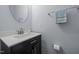 Stylish half-bathroom featuring a sleek vanity, modern faucet, and decorative mirror for guests at 533 Berry Chase Way, Cary, NC 27519