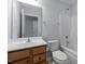 Bathroom with wood cabinet vanity, single sink, toilet, and shower-tub combo at 533 Berry Chase Way, Cary, NC 27519