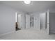 Comfortable bedroom features neutral carpet, paint, and open doors at 533 Berry Chase Way, Cary, NC 27519