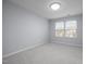 Bright bedroom features neutral paint, carpet, and windows bringing in natural light at 533 Berry Chase Way, Cary, NC 27519
