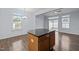 Modern kitchen featuring a breakfast area with abundant natural light, complemented by elegant chandelier lighting at 533 Berry Chase Way, Cary, NC 27519