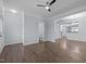 Open living room with elegant molding, dark hardwood floors, and a powder room for convenience at 533 Berry Chase Way, Cary, NC 27519