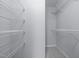 Walk-in closet features adjustable white metal shelving at 533 Berry Chase Way, Cary, NC 27519