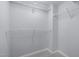Walk-in closet with carpet and adjustable metal shelving at 533 Berry Chase Way, Cary, NC 27519