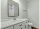 Bright bathroom featuring modern vanity, sink, and a shower with tub at 5512 Hickory Ln, Raleigh, NC 27603