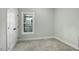 This is a neutral bedroom with a closet and a window letting in natural light at 5512 Hickory Ln, Raleigh, NC 27603