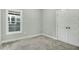 This bedroom features a window for natural light and double door closet at 5512 Hickory Ln, Raleigh, NC 27603