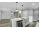 Spacious kitchen island with modern appliances open to a living area at 5512 Hickory Ln, Raleigh, NC 27603