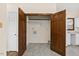 This laundry room features open bifold doors and neutral paint at 5738 Sentinel Dr, Raleigh, NC 27609
