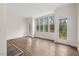 Sunroom with multiple windows, doors, and wood-look flooring at 5738 Sentinel Dr, Raleigh, NC 27609