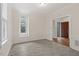 Bright living room with neutral paint, windows, and crown molding at 5738 Sentinel Dr, Raleigh, NC 27609