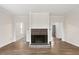 Living room featuring a black brick fireplace and wood flooring at 5738 Sentinel Dr, Raleigh, NC 27609