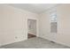 Open living area is painted a warm white with crown molding and lots of natural light at 5738 Sentinel Dr, Raleigh, NC 27609