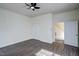 Bedroom featuring a ceiling fan, closet, and access to a staircase at 613 Mclean St, Spring Hope, NC 27882