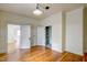 Bright bedroom with hardwood floors, beadboard ceiling, and spacious closet space at 613 Mclean St, Spring Hope, NC 27882