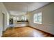 Bright dining room with hardwood floors and large window offering lots of natural light at 613 Mclean St, Spring Hope, NC 27882