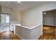 Bright hallway with wooden floors and views of the bathroom and bedroom at 613 Mclean St, Spring Hope, NC 27882