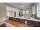 Modern kitchen with stainless steel appliances, tile backsplash and countertops, plus a kitchen island at 613 Mclean St, Spring Hope, NC 27882