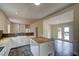 Bright kitchen features white cabinets, center island, and an open floor plan, great for entertaining at 613 Mclean St, Spring Hope, NC 27882