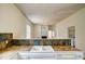 Close-up of the kitchen sink and backsplash, offering a practical and design-forward space at 613 Mclean St, Spring Hope, NC 27882