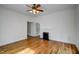 Light-filled living room boasting hardwood floors, a fireplace, and an open doorway at 613 Mclean St, Spring Hope, NC 27882