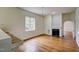 Elegant living room featuring hardwood floors, fireplace, and large window for lots of natural light at 613 Mclean St, Spring Hope, NC 27882