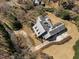 Spacious property with a pergola, solar panels, and a circular driveway, surrounded by mature trees and lush landscaping at 6336 Wrenwood Ave, Raleigh, NC 27607