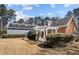 Exterior view showcasing the home's backyard, solar panels, and patio with pergola at 6336 Wrenwood Ave, Raleigh, NC 27607
