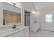 Elegant bathroom featuring double vanities, mirrors, and a separate water closet, blending style and functionality at 6336 Wrenwood Ave, Raleigh, NC 27607