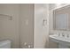 Powder room featuring a pedestal sink, decorative mirror, and classic fixtures against neutral walls at 6336 Wrenwood Ave, Raleigh, NC 27607