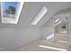 Upstairs bonus room with skylights and a view into the next room at 6336 Wrenwood Ave, Raleigh, NC 27607