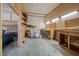 Spacious garage or workshop space, with multiple workbenches and a view of the car at 6336 Wrenwood Ave, Raleigh, NC 27607