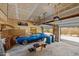 Spacious garage featuring a classic blue car, storage racks, and two garage doors at 6336 Wrenwood Ave, Raleigh, NC 27607