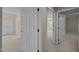 Hallway featuring a neutral color palette, carpeted floors, and doorways leading to additional rooms, enhancing the home's flow at 6336 Wrenwood Ave, Raleigh, NC 27607