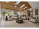 Inviting living room with vaulted wood ceiling, skylights, and natural light, creating a comfortable gathering space at 6336 Wrenwood Ave, Raleigh, NC 27607